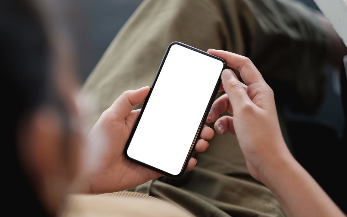 Blank Smartphone on Hand of Person 